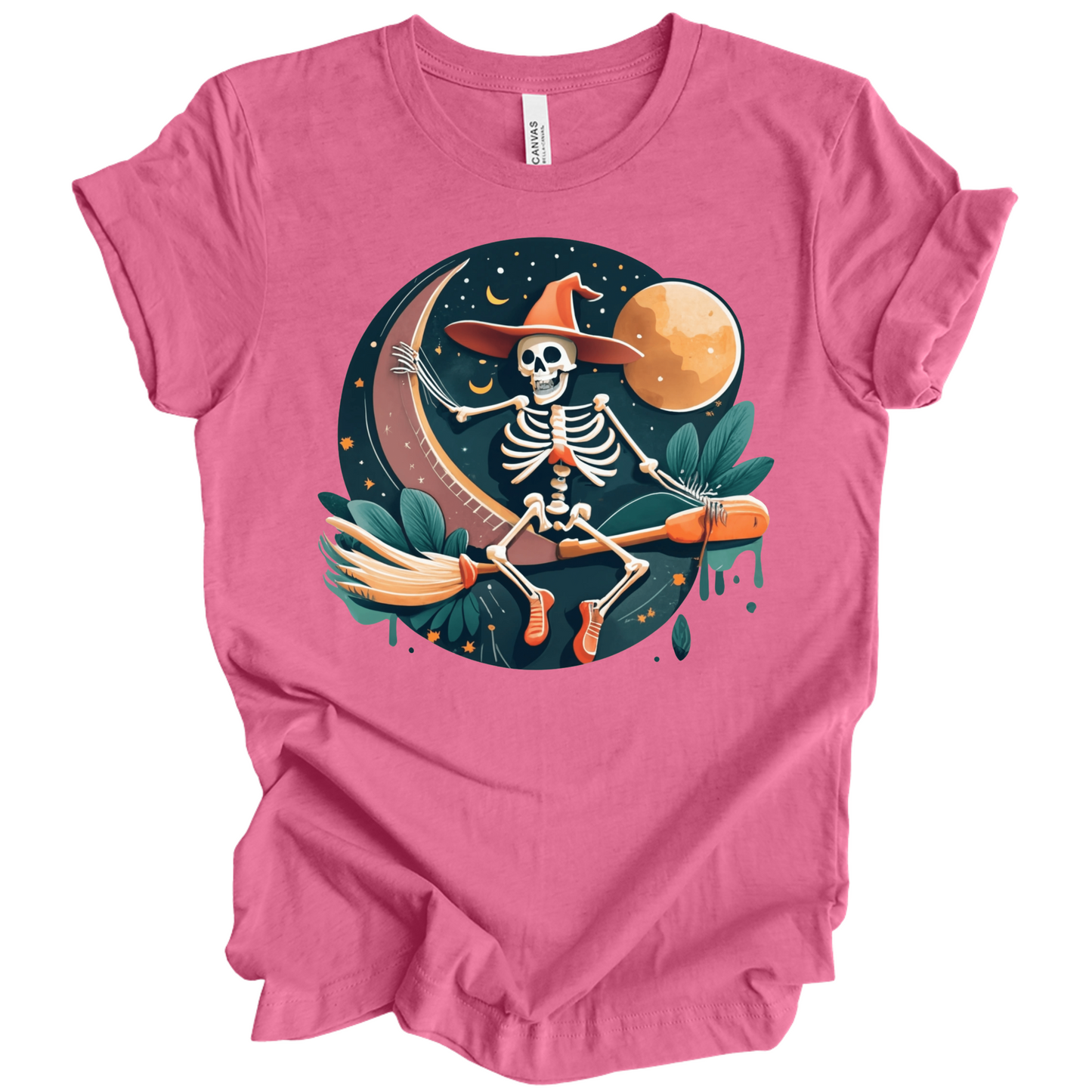 Pink halloween t-shirt with a skeleton on a broomstick wearing a witch hat in the night time.