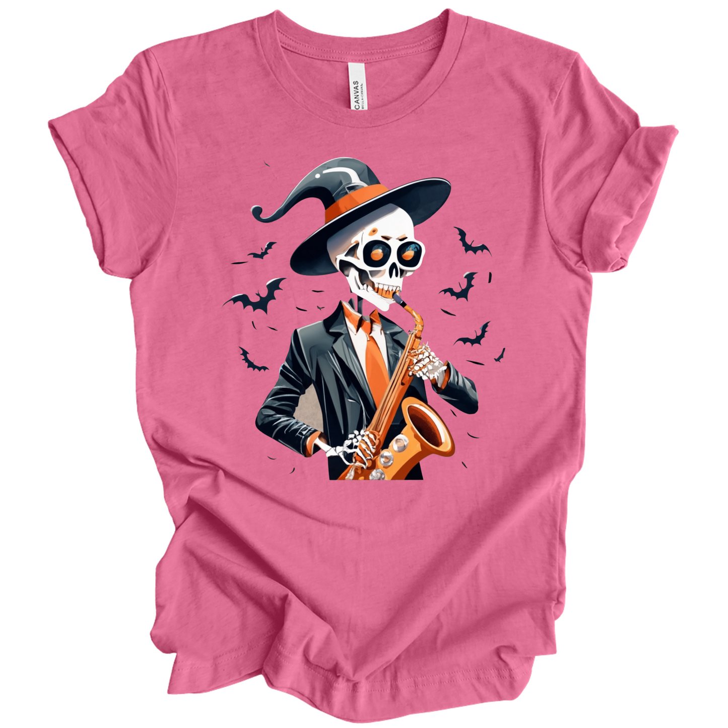 Pink halloween t-shirt with a skeleton playing a saxophone and wearing a witch hat, surrounded by bats.