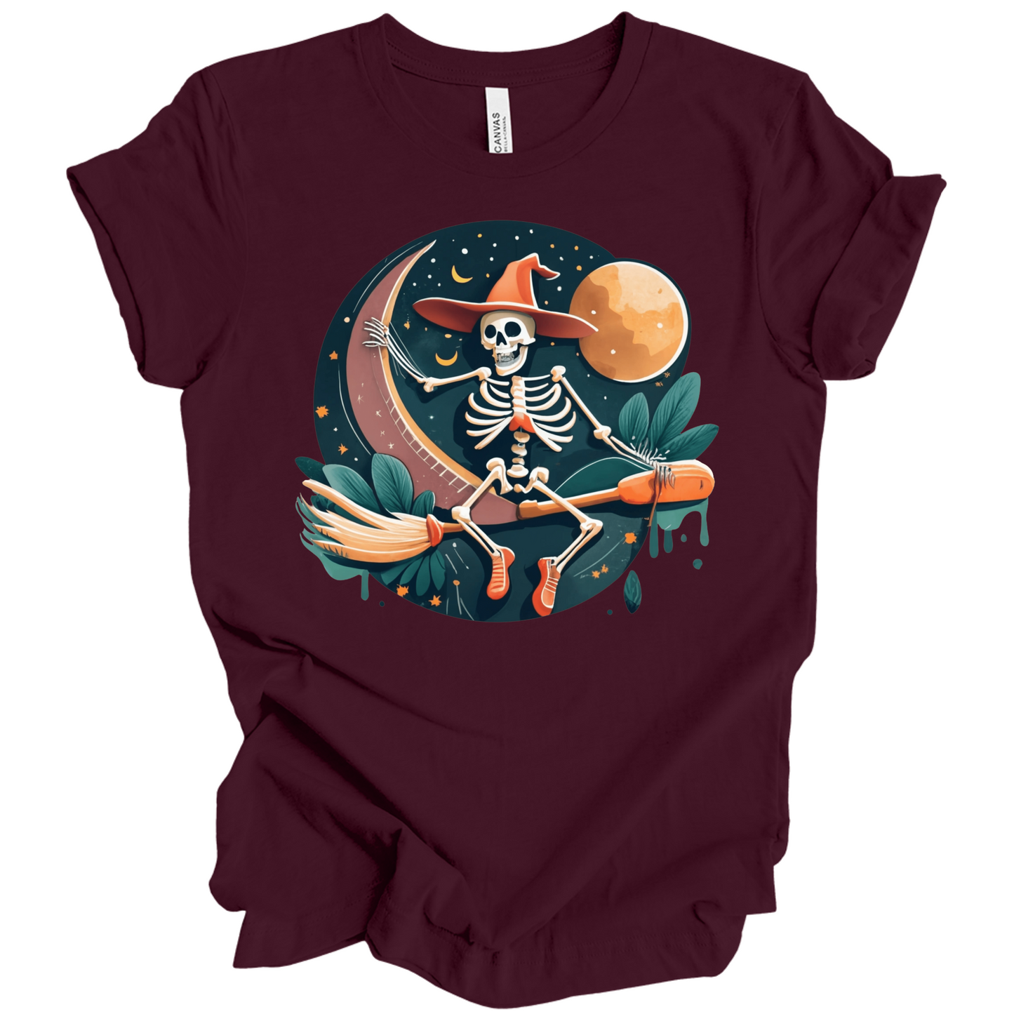 Maroon halloween t-shirt with a skeleton on a broomstick wearing a witch hat in the night time.