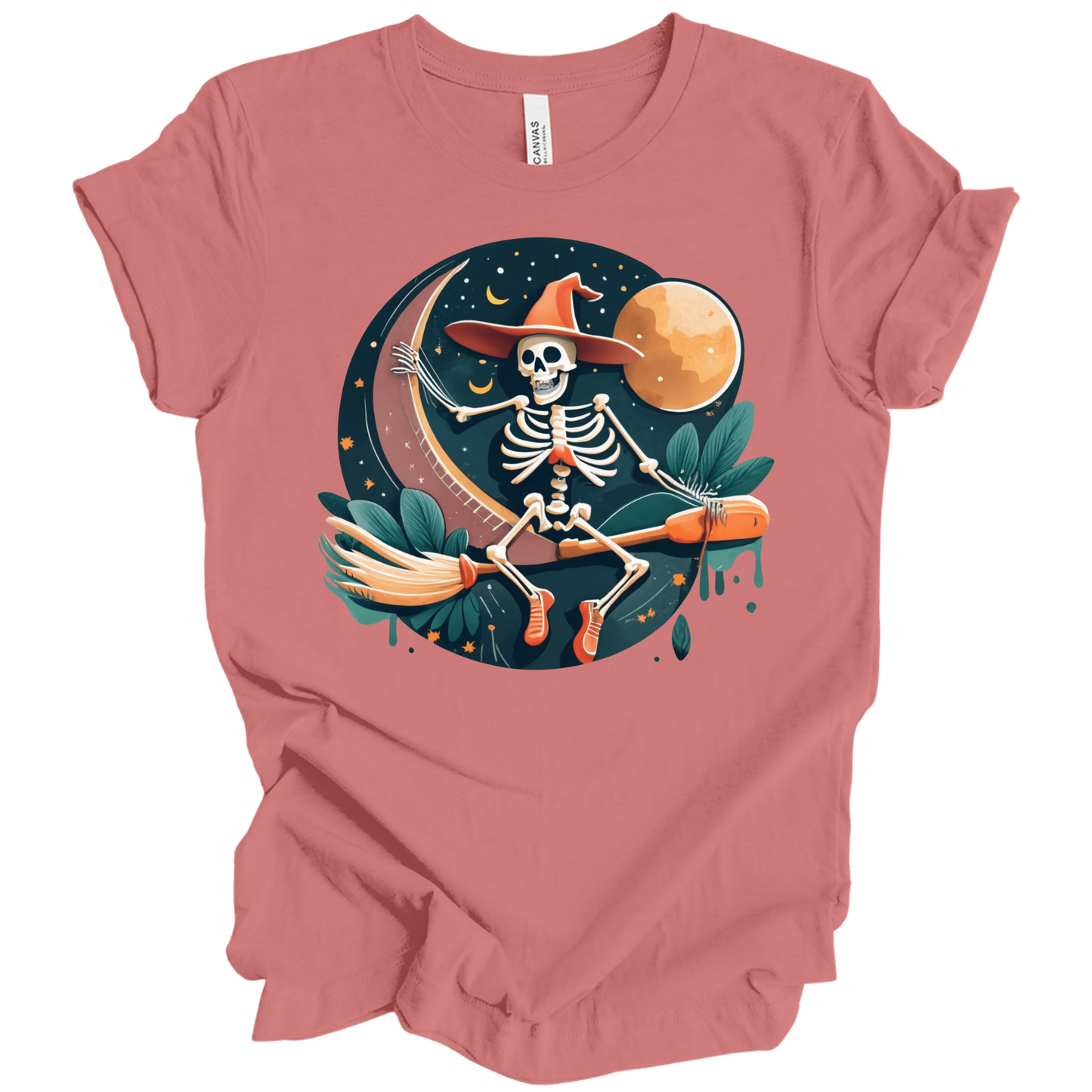 Pink halloween t-shirt with a skeleton on a broomstick wearing a witch hat in the night time.