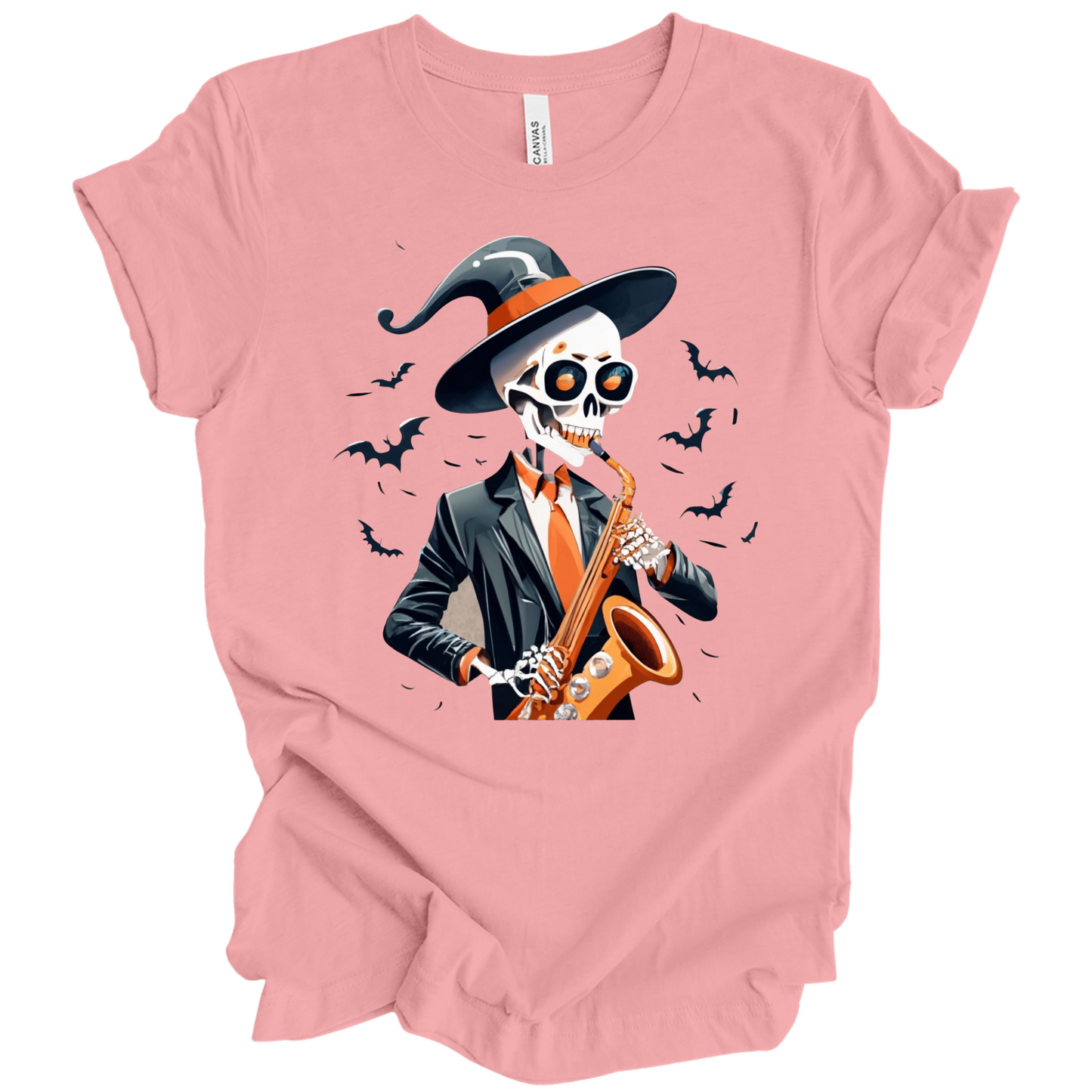 Pink halloween t-shirt with a skeleton playing a saxophone and wearing a witch hat, surrounded by bats.