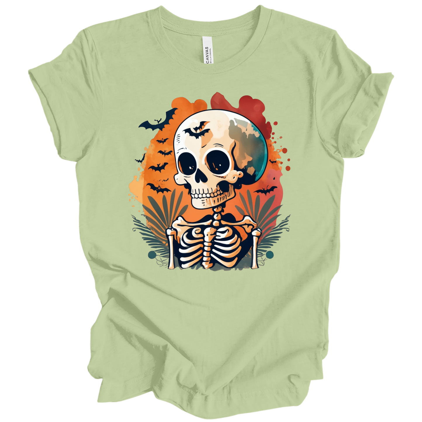 Light green t-shirt with a Halloween-themed design featuring a skeleton and skull surrounded with bats.