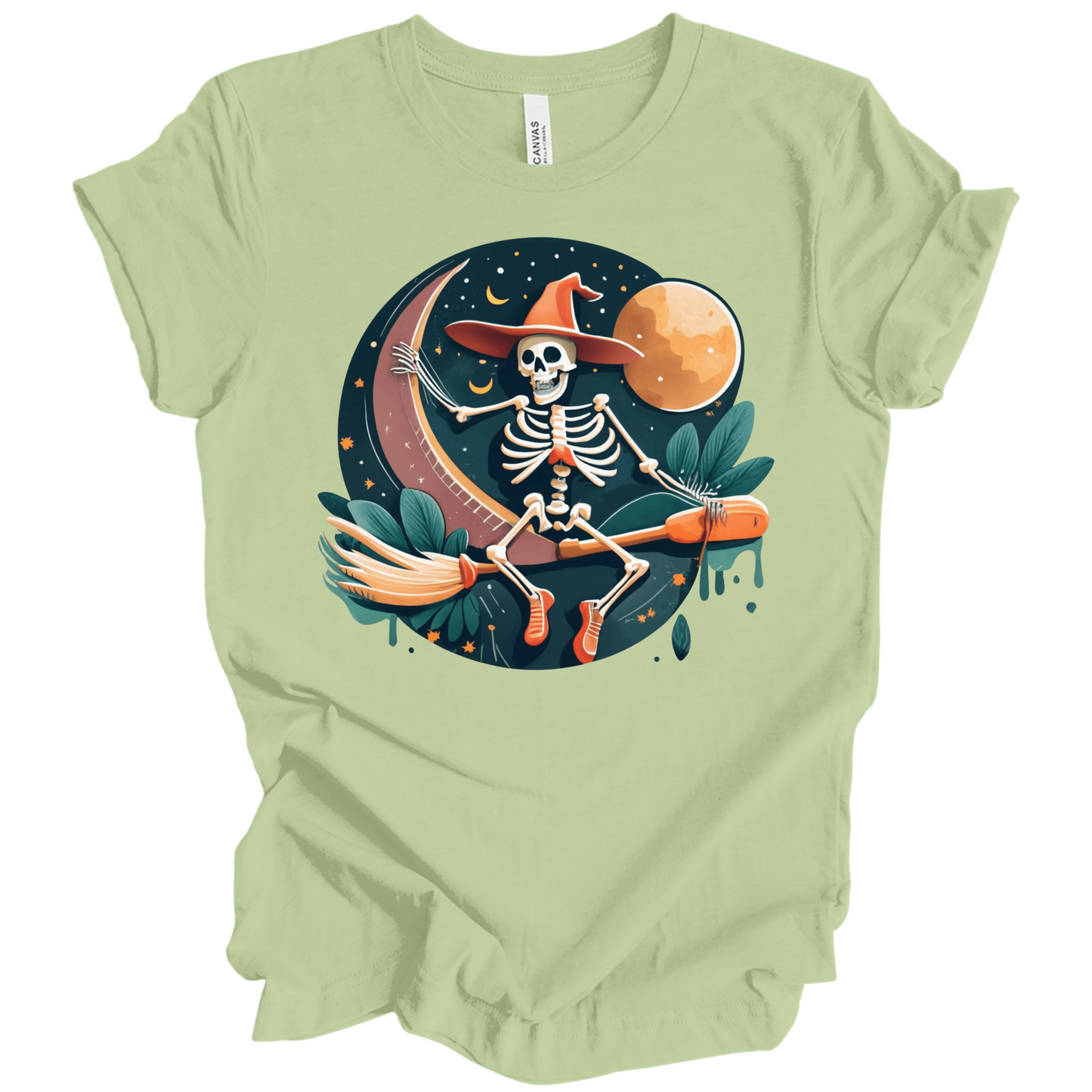 Light green halloween t-shirt with a skeleton on a broomstick wearing a witch hat in the night time.