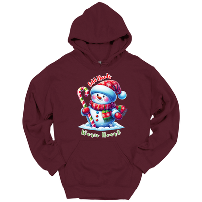 Maroon Christmas hoodie with a snowman graphic with a text "Cold Hands Warm Hearts"