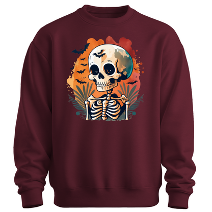 Maroon sweatshirt with a Halloween-themed design featuring a skeleton and skull surrounded with bats.