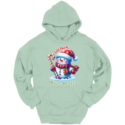 Mint green Christmas hoodie with a snowman graphic with a text "Cold Hands Warm Hearts"