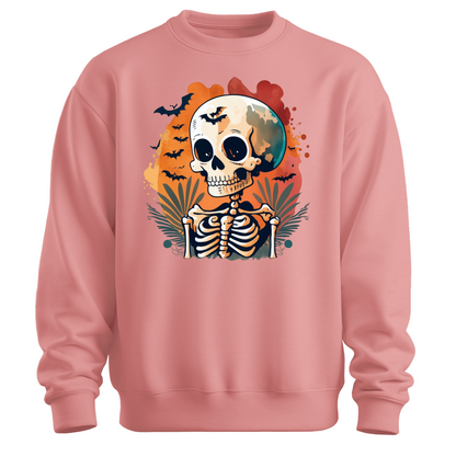 Pink sweatshirt with a Halloween-themed design featuring a skeleton and skull surrounded with bats.