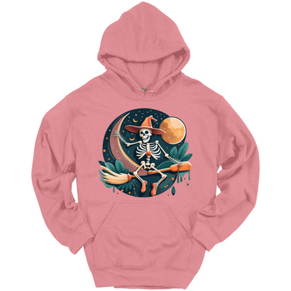 Pink halloween hoodie with a skeleton on a broomstick wearing a witch hat in the night time.