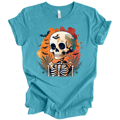 Blue t-shirt with a Halloween-themed design featuring a skeleton and skull surrounded with bats.