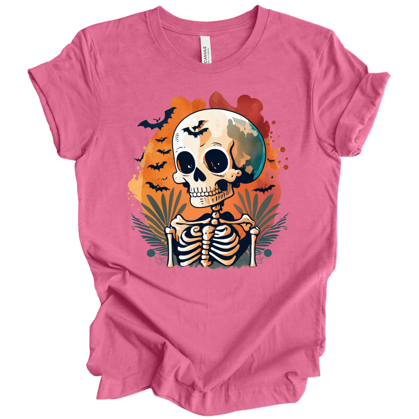 Pink t-shirt with a Halloween-themed design featuring a skeleton and skull surrounded with bats.