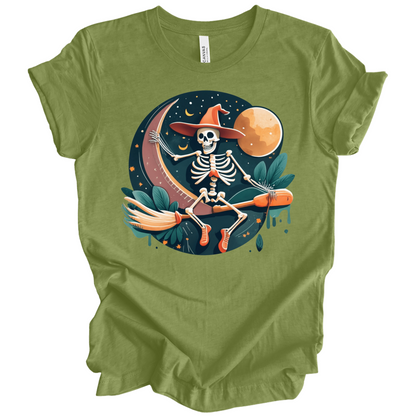 Green halloween t-shirt with a skeleton on a broomstick wearing a witch hat in the night time.