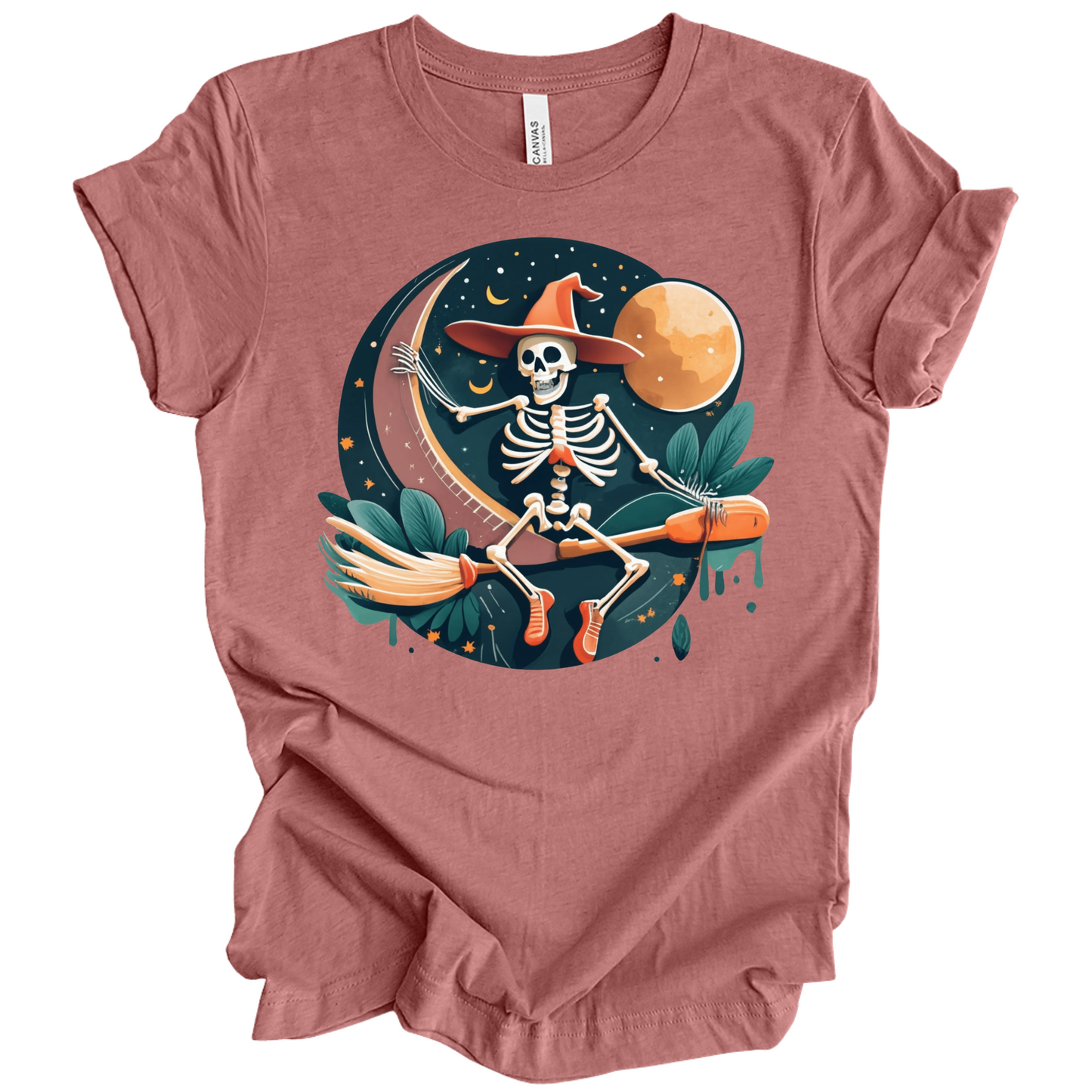 Pink halloween t-shirt with a skeleton on a broomstick wearing a witch hat in the night time.