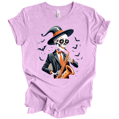 Light Purple halloween t-shirt with a skeleton playing a saxophone and wearing a witch hat, surrounded by bats.