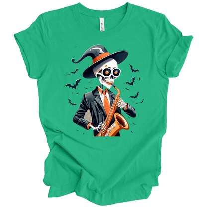 Green halloween t-shirt with a skeleton playing a saxophone and wearing a witch hat, surrounded by bats.