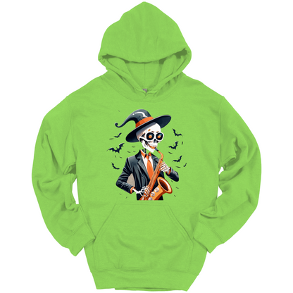 Green halloween hoodie with a skeleton playing a saxophone and wearing a witch hat, surrounded by bats.