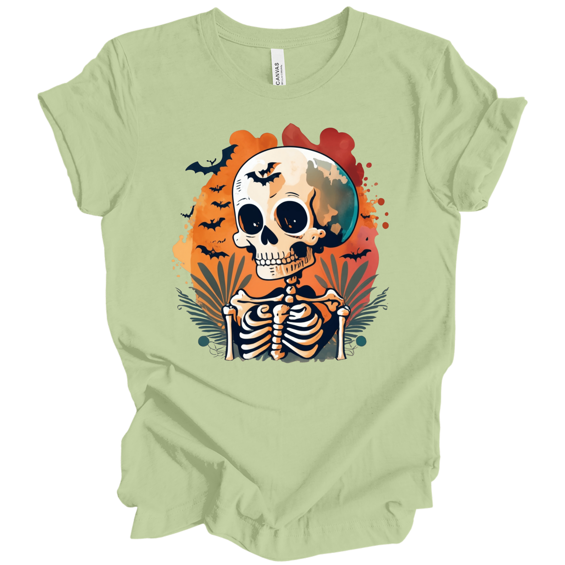 Light green t-shirt with a Halloween-themed design featuring a skeleton and skull surrounded with bats.