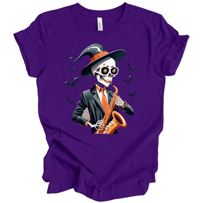 Purple halloween t-shirt with a skeleton playing a saxophone and wearing a witch hat, surrounded by bats.