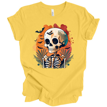 Yellow t-shirt with a Halloween-themed design featuring a skeleton and skull surrounded with bats.